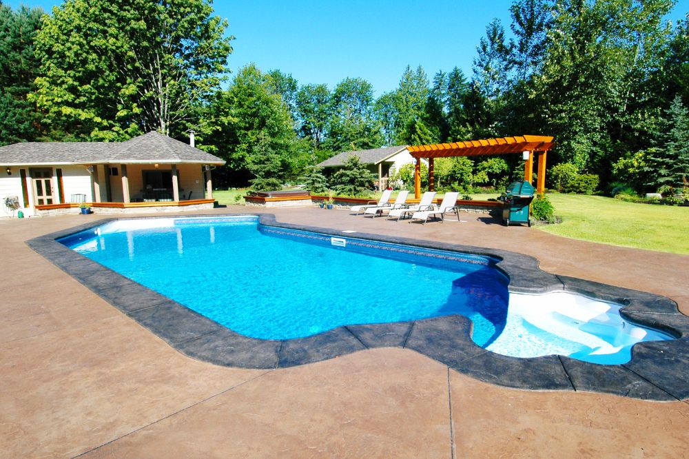 How do I prepare my backyard before pool construction starts